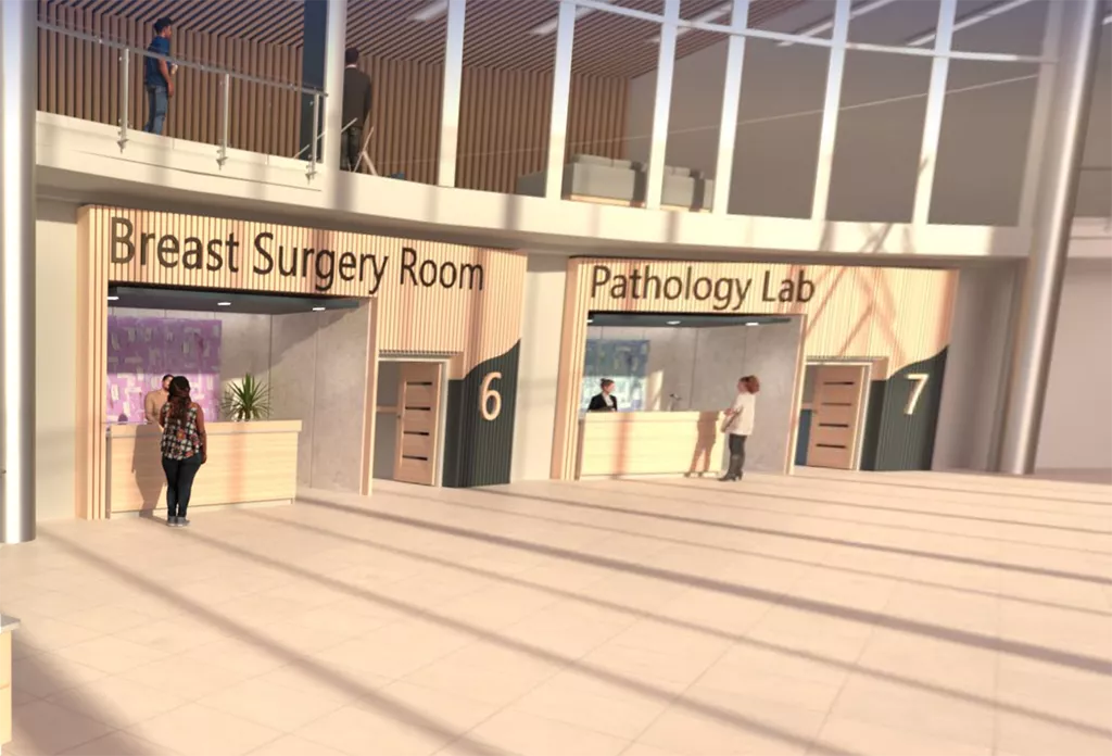 Una mujer en el hospital virtual, frente a la sala de cirugía de mama y el laboratorio de anatomía patológica